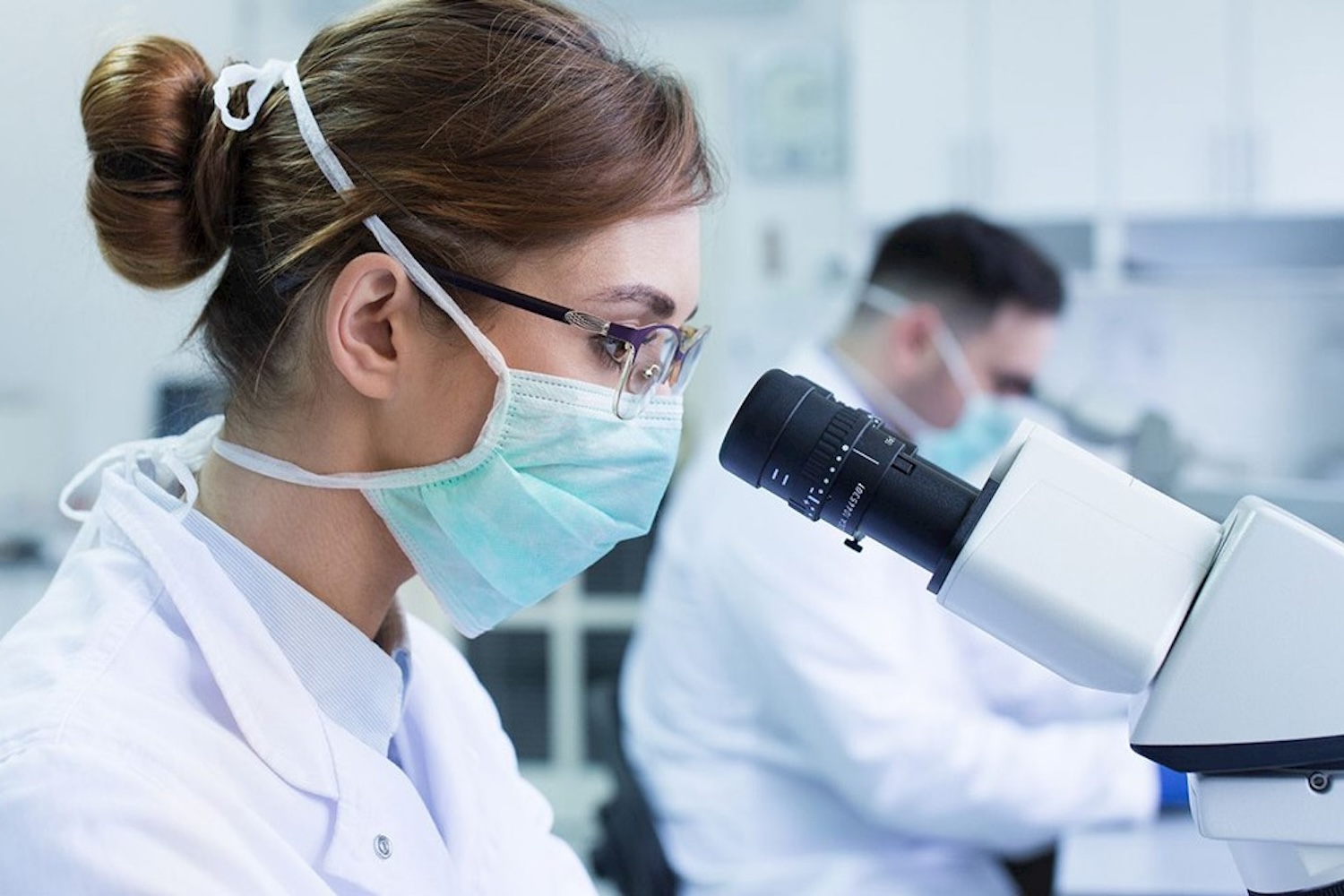 Researchers working on microscopes